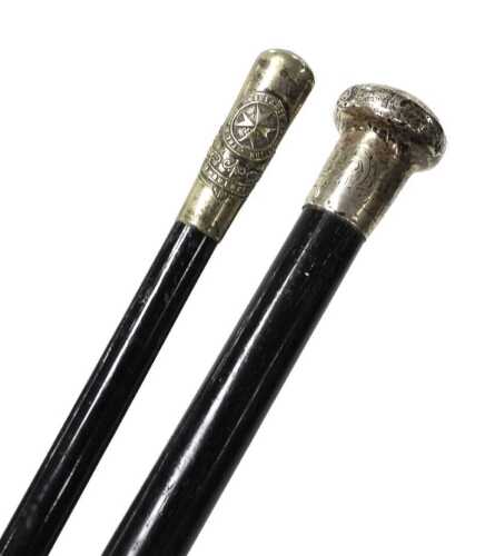 An early 20thC ebony walking cane, with a silver handle, indistinct Birmingham hallmarks, 90cm...