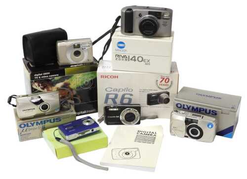 A Ricoh Caplio R6 digital camera, and others, including a Technika 5mp camera, a Minolta Riva...