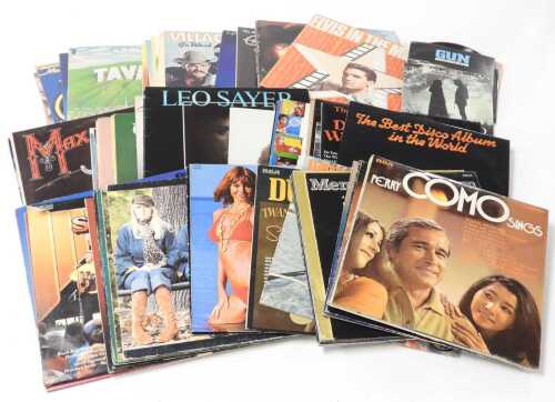 A collection of LP records, including Elvis Presley, Nat King Cole, The Carpenters, Simon and...