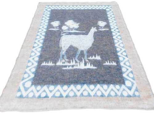A late 20thC South African llama wool blanket, decorated with a llama and trees, within a...
