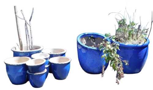A group of blue glaze garden plant pots, of differing size, the largest 40cm high.