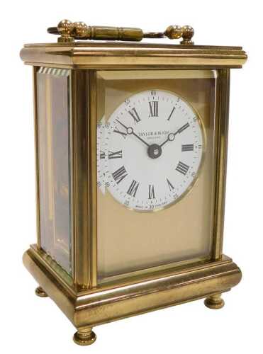 A brass cased carriage clock by Taylor and Bligh, visible escapement, swing handle, 15cm high,...