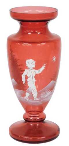 A Mary Gregory style cranberry glass vase, of baluster form, with hand painted decoration of a...