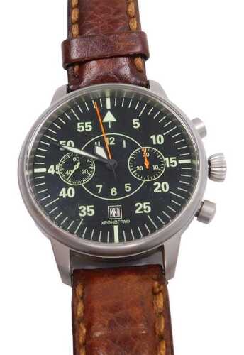 A Poljot gentleman's wristwatch, with illuminated black dial and date, brown leather strap, cased.