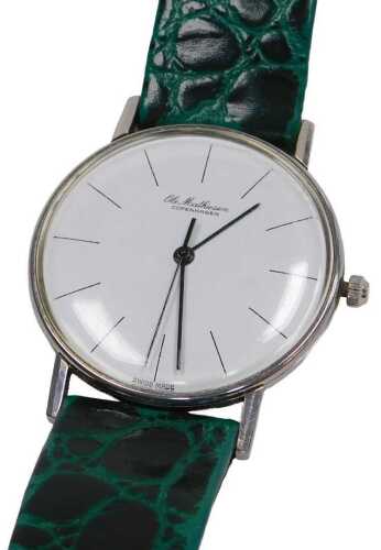 An Ole Mathiesen gentleman's wristwatch, stainless steel case, green leather strap.