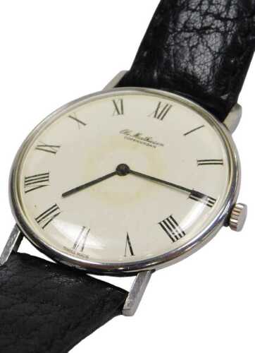 An Ole Mathiesen gentleman's wristwatch, black leather strap.
