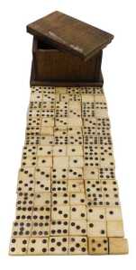 Forty-five 19thC bone dominoes, up to eight spots, each 3.5cm wide, in a wooden box.