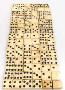 Forty-five 19thC bone dominoes, up to eight spots, each 3.5cm wide, in a wooden box. - 2