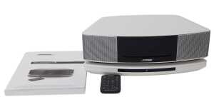 A Bose Wave SoundTouch music system, series IV, with remote and instructions.