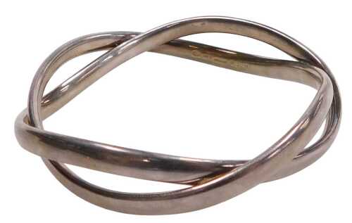 A George Jensen silver bracelet, designed by Astrid Fog, of plain twisted interwoven design,...