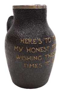 A Doulton Lambeth stoneware leather jug, with a silver mount, to tube line decorated "Here's to...