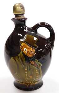 An early 20thC Royal Doulton pottery Dickens ware flagon, with a stopper, decorated with... - 2