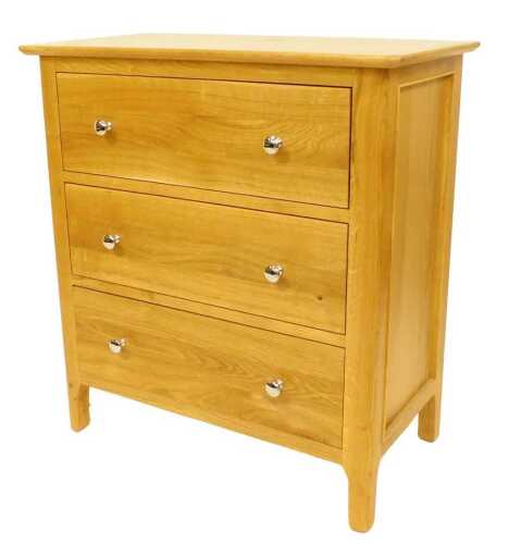 A contemporary oak chest of drawers, the top with a rounded edge above three drawers, raised on...