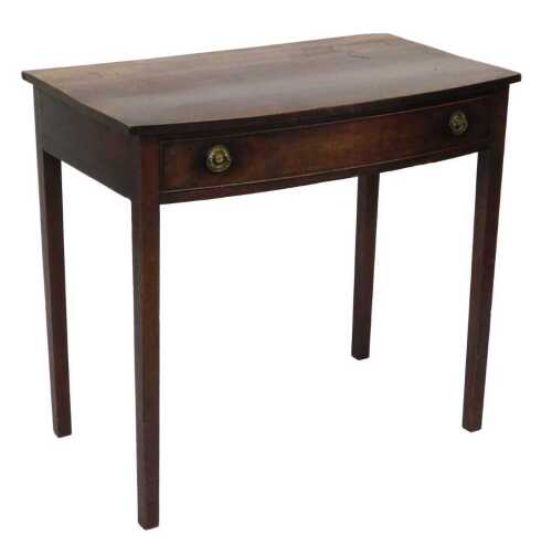 A George III mahogany bow front side table, with a single frieze drawer raised on square legs,...