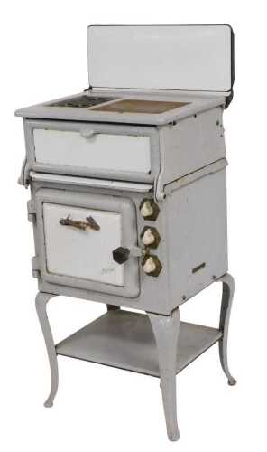 A 1930s cast iron enamelled two colour Jackson stove, 53cm wide.