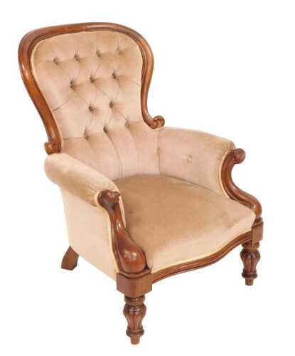 A Victorian mahogany spoon back show frame armchair, with cabriole legs. VAT is payable on...