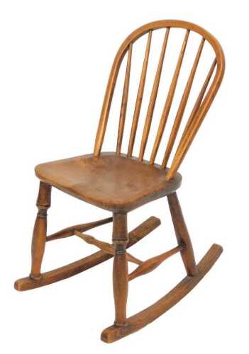 A 19thC Lincolnshire spindle back Windsor side chair by Marsh of Sleaford, with rocker base, and...