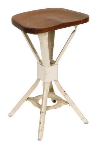 A 1930s industrial machinist's stool, with mahogany seat.