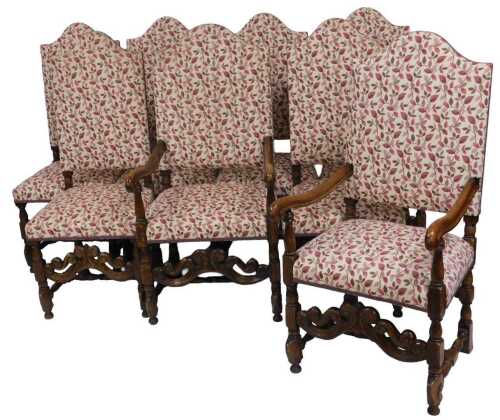 A set of eight tapestry upholstered highback dining chairs in Carolean style, including two oak...