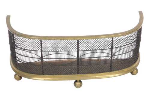An early 19thC brass and wirework bedroom fire fender spark guard, 63cm wide.