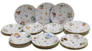 A 20thC Herend porcelain part dinner service, painted with fruit, nuts and floral sprigs, within...