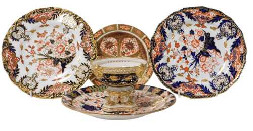 A group of 19thC Crown Derby Imari porcelain, including two plates decorated with flowers and...