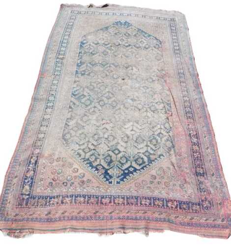 An early 20thC Turkish design rug. (AF) 295 x 156cm.