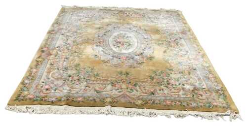V - A Chinese hand cut wool mustard ground floral carpet, 174cm wide. VAT is payable on hammer price...