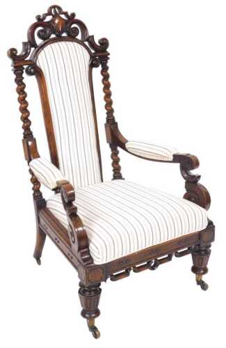 A Victorian rosewood open armchair, the back with a pierced scrolling crest around a cartouche,...