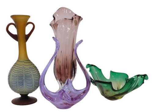 Four late 20thC glass bowls or vases, including a Murano green glass bowl, of scrolling leaf...