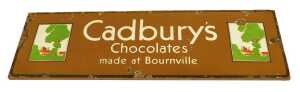 An early 20thC enamel Cadbury's Chocolates sign, made at Bournville, with two pictures of the...