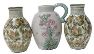A Bourne Denby Danesby ware pottery jug, relief decorated with pink flowers, and a printed mark,...