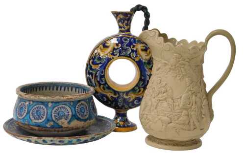 An Islamic turquoise pottery bowl, decorated floral roundels, together with a similar dish, an...