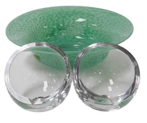 A 20thC green glass bowl, possibly Monart, 26cm wide, together with a pair of glass ashtrays, of...