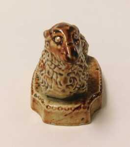 A 19thC stoneware sheep, on a rectangular base, with re-entrant corners, 7cm long. VAT is... - 2