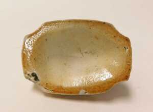 A 19thC stoneware sheep, on a rectangular base, with re-entrant corners, 7cm long. VAT is... - 5
