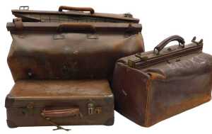 An early 20thC tan leather Gladstone bag, 56cm wide, another smaller Gladstone bag, and a...
