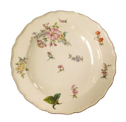 An 18thC Chelsea red anchor period plate, painted in Deutche Blumen floral sprays, mark to...