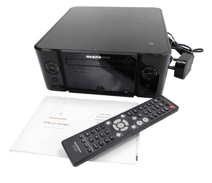 A Marantz CD receiver, M-CR611, with remote and set up guide.