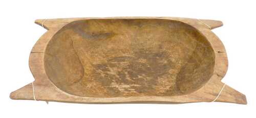 A 19thC carved wooden trencher dough bowl, 54cm wide.