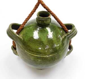 A 19thC French Provincial green glaze pottery conscience jug, green glazed, with four loop... - 2
