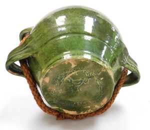 A 19thC French Provincial green glaze pottery conscience jug, green glazed, with four loop... - 4