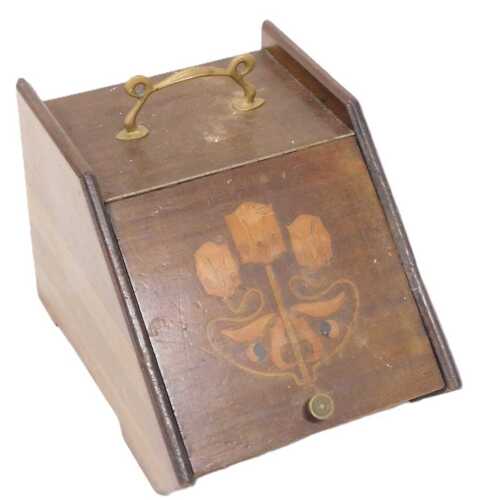 An Art Nouveau mahogany coal scuttle, the lift up lid inlaid with floral motifs, enclosing a...