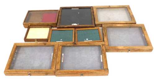 A group of pine and oak framed table top display cases, the largest 53cm wide.