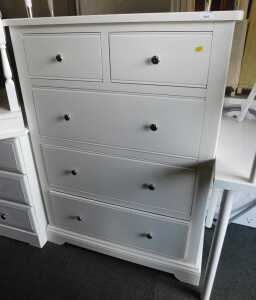 A modern white finished chest, of two short over three long drawers, raised on bracket feet,...