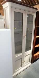 A contemporary grey finished display cabinet of two glazed doors with glass shelves to interior,...