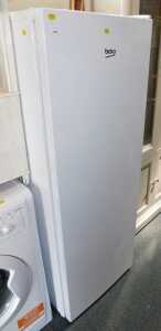 A Beko upright fridge, in white.