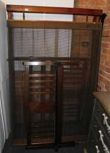 A late Victorian 4ft bed, with headboard, tailboard, and base unit.