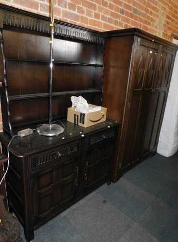 Furniture, comprising an Old Charm oak wardrobe, with carved doors, opening to reveal a mirror...