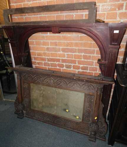 A late Victorian mahogany fireplace surround, the arched central section with carved and moulded...